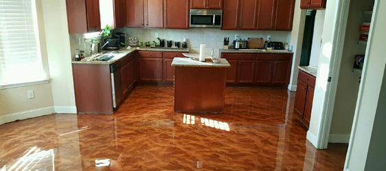 This image shows a kitchen with brown epoxy floor.