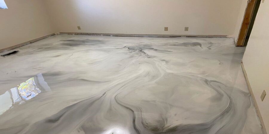 This image shows a metallic epoxy floor. The color used was white and gray.